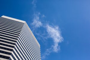 clean-skyscraper-view-from-below-against-blue-sky-and-clouds-picjumbo-com